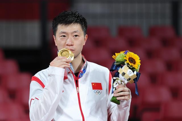 九游会-马龙的2021：东奥成就乒坛第一人 33岁仍在路上